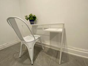 a white desk with a chair and a potted plant at Yorkmills and Bayview !B Spacious and Stylish Private Bdr with Shared Bathroom in Toronto +5 photos