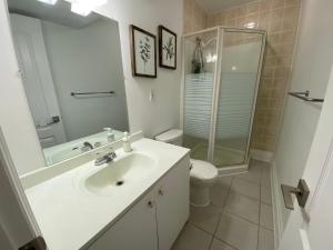 a bathroom with a sink and a shower and a toilet at Yorkmills and Bayview !B Spacious and Stylish Private Bdr with Shared Bathroom in Toronto