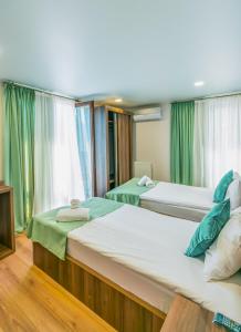 Postel nebo postele na pokoji v ubytování Hotel Classic Suites