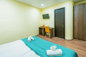 Postel nebo postele na pokoji v ubytování Hotel Classic Suites