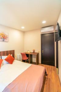 Postel nebo postele na pokoji v ubytování Hotel Classic Suites