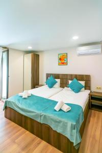 Postel nebo postele na pokoji v ubytování Hotel Classic Suites