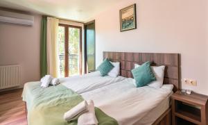 Postel nebo postele na pokoji v ubytování Hotel Classic Suites