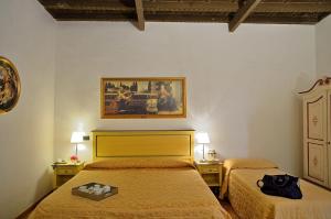 Кровать или кровати в номере Hotel Vasari