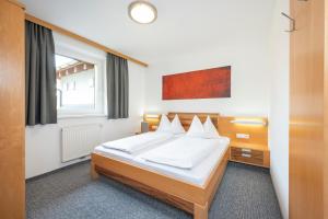 Postel nebo postele na pokoji v ubytování Sunshine Appartements Schilchegger