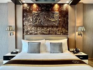 Voodi või voodid majutusasutuse KTK Pattaya Hotel & Residence toas