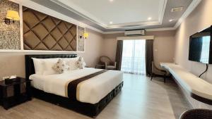 Voodi või voodid majutusasutuse KTK Pattaya Hotel & Residence toas