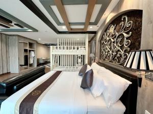 Voodi või voodid majutusasutuse KTK Pattaya Hotel & Residence toas