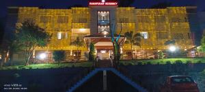 a hotel at night with a building at RJ ROSS RAMAPURAM in Munnar