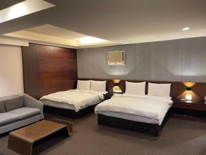 Postel nebo postele na pokoji v ubytování Sun Sweet Hotel