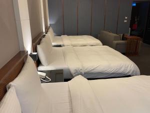 Postel nebo postele na pokoji v ubytování Sun Sweet Hotel