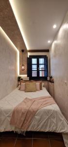 Säng eller sängar i ett rum på Apartamento El Atajo