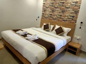 Postel nebo postele na pokoji v ubytování VIPs Hotel Olive