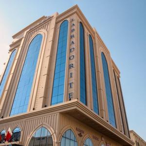a tall building with glass windows on top of it at لابرادوريت in Jeddah