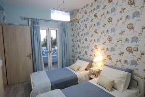 Postel nebo postele na pokoji v ubytování Vacation house with stunning view - Vari Syros
