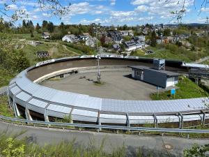 a large amphitheater with a building in a city at Dein Winterberg Apartment - WIFI Geschirrspüler Smart TV in Winterberg