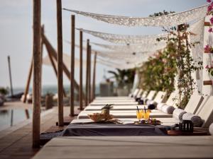 a long table with plates of food and drinks on it at GARDELLI RESORT in Laganas