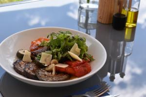a bowl of food with meat and vegetables on a table at Eco Niebor&oacute;w in Niebor&oacute;w