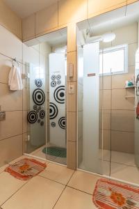 a shower with a glass door in a bathroom at HOSTEL HOME ACADEPOL METRO BUTANTA e USP in Sao Paulo +40 photos