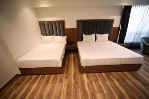 Postel nebo postele na pokoji v ubytování Hotel The Sawai