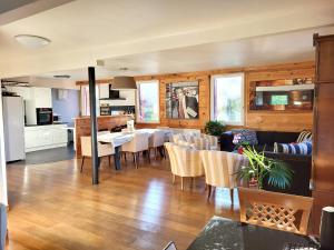 a living room with a kitchen and a dining room at Appartement de 3 chambres avec jardin clos et wifi a Mont Saxonnex in Mont-Saxonnex