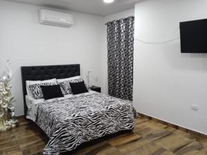 Voodi või voodid majutusasutuse Hotel Real del Valle toas