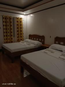 Postel nebo postele na pokoji v ubytování Rabang Traveller's Inn