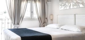 เตียงในห้องที่ Albergo Diffuso Mannois