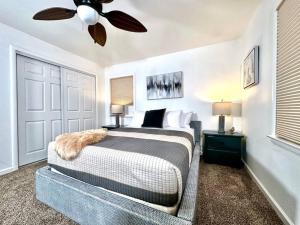 a bedroom with a bed and a ceiling fan at King Bed-Huge Yard-Quiet Neighborhood-Garage in Sacramento