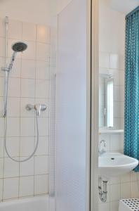 a bathroom with a shower and a sink at Haus Wendland Haus Wendland in Norderney +17 photos