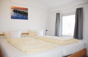 Postel nebo postele na pokoji v ubytování Ferienhaus Pauls Ferienhaus Pauls, Whg 09