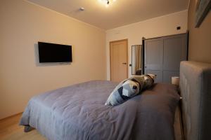 Postel nebo postele na pokoji v ubytování Kastani Apartments