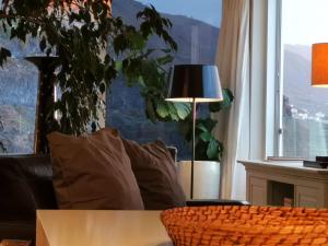 a living room with a table and a couch and a window at Tenerife Stay Ocean Front I in San Marcos +43 photos