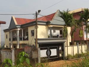 a large white house with a red roof at Appartement New Stading YAOUNDE - MIMBOMAN MAETURE in Yaoundé