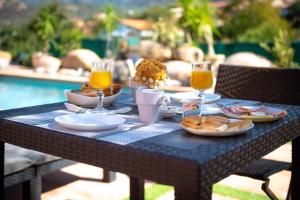 a blue table with food and drinks on it at A CASA DI JO in Calenzana