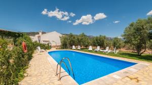 a swimming pool in the backyard of a house at Molino de Peralta Pozo Alcón by Ruralidays in Pozo Alcón
