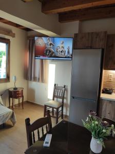 Televízia a/alebo spoločenská miestnosť v ubytovaní Castello casa