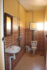 a bathroom with a sink and a toilet at La Belle étoile in Aït Oussane