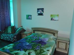
Кровать или кровати в номере Гостевой Дом Зеленые фонарики
