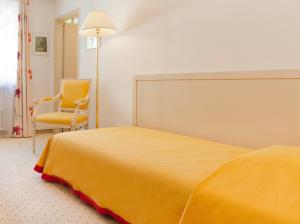 Ліжко або ліжка в номері Hotel Tamaro