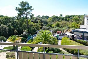 a view from the balcony of a resort with trees at Thalazur Arcachon in Arcachon