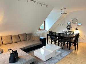 a living room with a couch and a table at Apartment an der Altstadt in Hameln