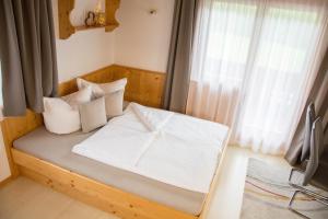 Posteľ alebo postele v izbe v ubytovaní Ferienhaus Mühlstein
