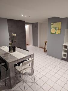 a kitchen with a table and chairs in a room at Flensburg Zentrum 69 05 in Flensburg