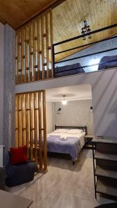 Krevet ili kreveti u jedinici u objektu Kheta Apartments Kazbegi