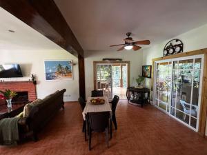 a living room with a couch and a table at Hacienda Claro de Luna 3 Bedrooms in Jarabacoa