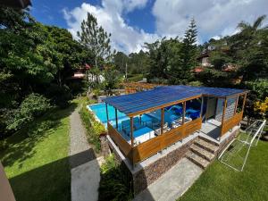 an overhead view of a house with a pool at Hacienda Claro de Luna 3 Bedrooms in Jarabacoa