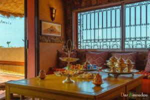 a table with bowls of food on top of it at Dar Amoudou in Ouarzazate