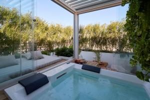 a swimming pool in the middle of a house at Musae Relais & SPA in Polignano a Mare