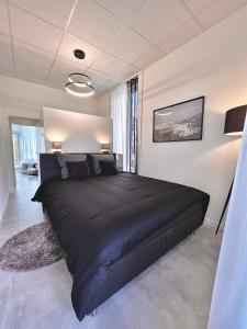 Postel nebo postele na pokoji v ubytování Logement Miéville 7 l Travers centre
